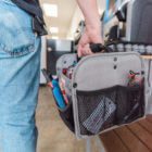man carrying toolbox