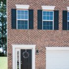 brick house with attached garage