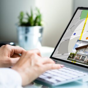 A person on a laptop looking up townhouses for lease.
